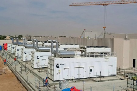 Multiple containerized Cummins generators installed at commercial facility with parallel interconnect piping and control infrastructure 4S52Mga6uIkMFk7bEi-Jv4VqX8KQdGpXmGcXON0oXEs=.jpg