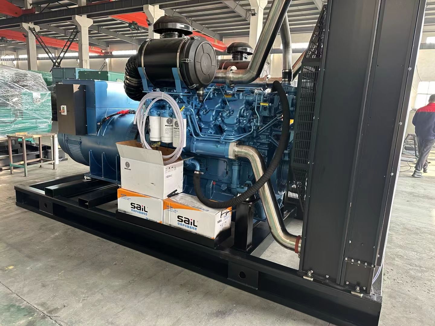 Diesel generator set built for industrial standby duty, shown complete with canopy, control panel and base frame
